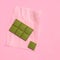 Vegan low carb matcha white chocolate on pastel pink background