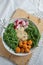 Vegan lunch bowl with quinoa, hummus, chickpeas, avocado