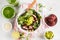 Vegan lunch flat lay. Green vegetable vegan salad with beets meatballs, Guacamole and tahini dressing. Healthy vegetarian food co