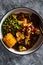 Vegan mixed vegetable roast with spicy broth, healthy plant-based food