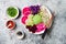 Vegan poke bowl with avocado, beet, pickled cabbage, radishes. Top view, overhead