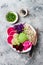 Vegan poke bowl with avocado, beet, pickled cabbage, radishes. Top view, overhead, flat lay.