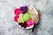 Vegan poke bowl with avocado, beet, pickled cabbage, radishes. Top view, overhead, flat lay.