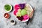 Vegan poke bowl with avocado, beet, pickled cabbage, radishes. Top view, overhead, flat lay.