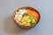 Vegan poke bowl recipe with tofu tacos, ripe avocado pieces, edamame beans with salt and filleted carrot