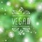 Vegan product label on blurred background