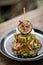 Vegan quinoa cakes with roasted eggplant and red pepper sauce