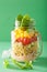 Vegan quinoa vegetable salad in mason jar