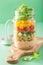 Vegan quinoa vegetable salad in mason jars
