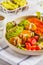 Vegan Rainbow bowl: vegetable meatballs, avocado, sweet potato a