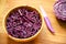 Vegan raw salad with violet cabbage on a wooden table