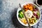 Vegan rice and vegetables salad. Macrobiotic set with rice, hummus, avocado, broccoli and sweet potato