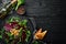 Vegan salad: beets, arugula and chickpeas on a black stone plate. Healthy diet food. Top view.