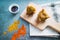 Vegan samosas on a table with spicy sauce. Indian cuisine. Close up view