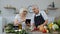 Vegan senior grandparents looking for a culinary recipe online on digital tablet, cooking salad