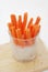 Vegan Snack Carrot Batons in a Glass Cup Served as Crudites Isolated a Healthy Appetizer to a Meal