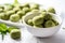 vegan snacks dyed green resting in a white bowl