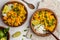 Vegan Sweet Potato Chickpea curry in wooden bowl on light background, top view, copy space. Healthy vegetarian food concept.