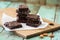 Vegan sweets. Stack of homemade low calorie no sugar brownies wi