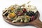 vegan tapas snacks sharing platter board on white background