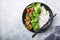 Vegan teryaki  tempeh or tempe buddha bowl  with rice, steamed broccoli, spinach  and lime on gray background. Healthy food