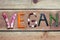 vegan word on wood background