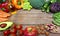 Vegan word on wood background and vegetable