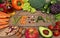 Vegan word on wood background and vegetable - food