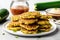 Vegan Zucchini Fritters On White Round Plate On White Background. Generative AI