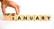 Veganuary in january symbol. Doctor turns wooden cubes and changes the concept word january to veganuary. Beautiful white