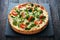 Vegatable pie ( quiche) with broccoli, tomatoes and soft cheese