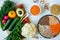 Vegen food on a light background, fresh vegetables and cereals on a plate top view