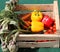 vegetable box with peppers and artichokes