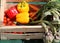 Vegetable box with peppers and artichokes and ohther vegetables