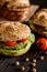 Vegetable burger with chickpeas - spinach fritter, lettuce and tomato
