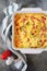 Vegetable Clafoutis with red bell pepper and zucchini in ceramic dish