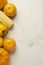 Vegetable concept a few yellow and orange vegetable sorted together on the white tile table