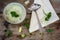 Vegetable creme soup with leek in a earthware bowl on a rustic