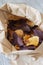 Vegetable crisps in a paper bag.  Sweet potato, beetroot and parsnip flavour.