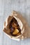 Vegetable crisps in a paper bag.  Sweet potato, beetroot and parsnip flavour.