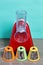 Vegetable cutter with various nozzles. Standing on the tabletop. Against the background of mint color