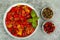 Vegetable dish of stewed sweet peppers and tomatoes, lecho, vegetarian menu. Studio Photo.
