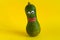 vegetable with googly eyes and mouths made of plasticine on a yellow background,GMO foods and hand made games with kids