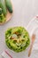 Vegetable green salad bowl on kitchen table, balanced diet