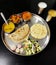 Vegetable Gujarati kathiyawadi thali on table, Indian thali meal