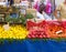 Vegetable market. On the counter are radishes, carrots, lemons, broccoli