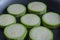 Vegetable marrows frying on a pan close-up