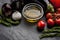 Vegetable mix with olive oil and rosemary on the black stone table