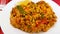 Vegetable paella with red pepper and tomato