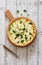 Vegetable pie quiche with broccoli and soft cheese over white